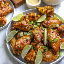 a plate piled high with chicken wings