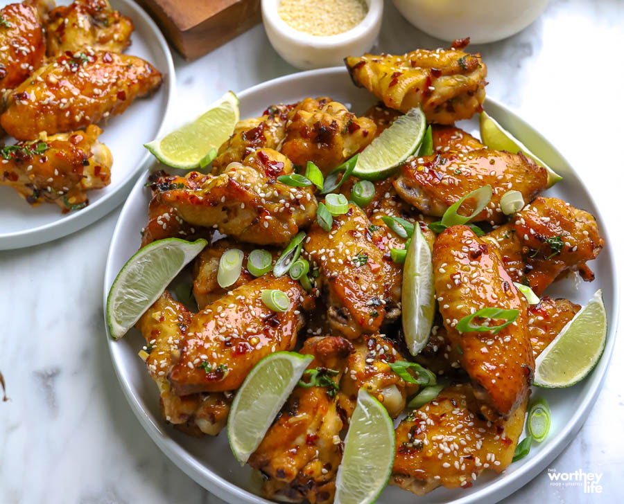 a plate piled high with chicken wings