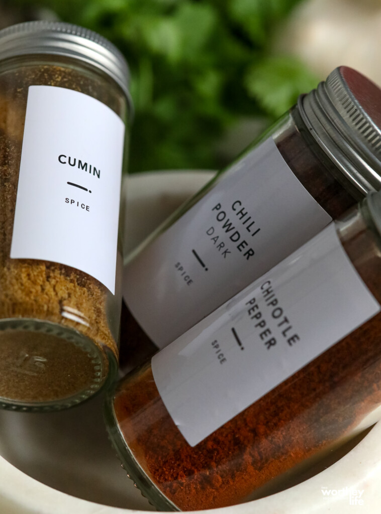 fresh seasonings in labeled bottles