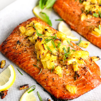 honey pineapple salmon on parchment paper