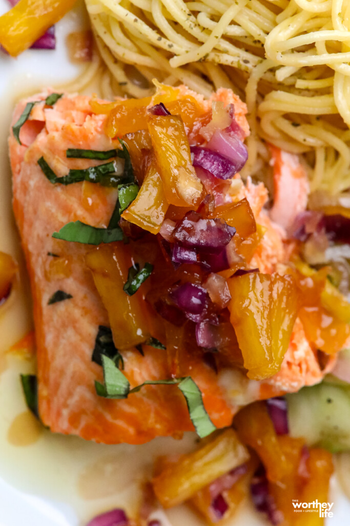 Salmon with fresh pineapple paired with Alfredo pasta