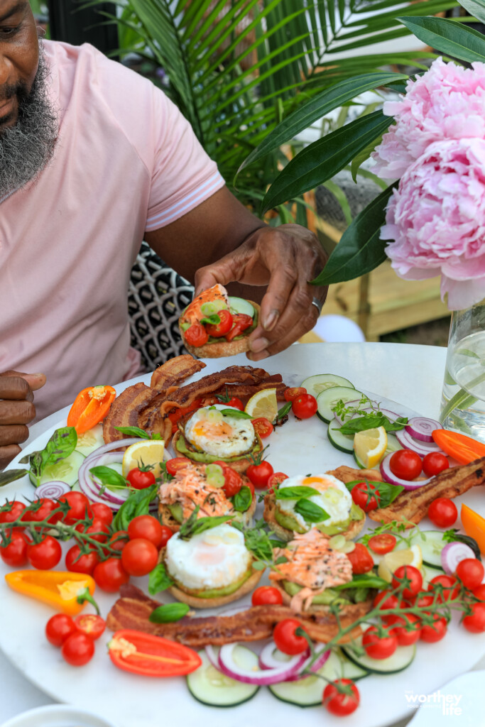 man eating Salmon Brunch sliders