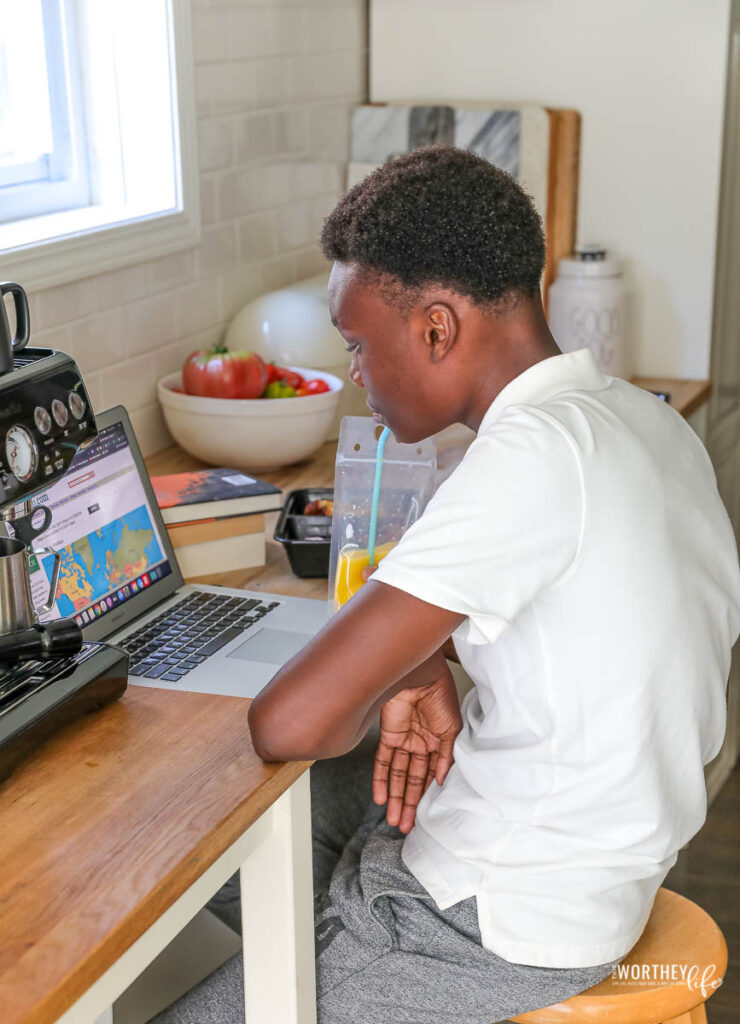 teen sitting at the table having lunch