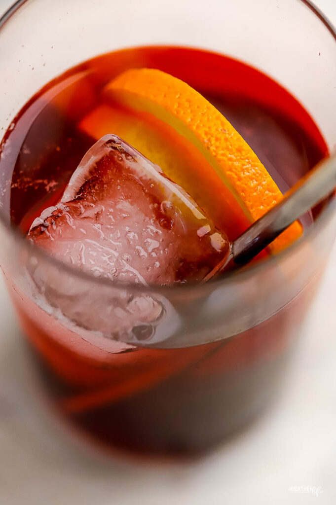 a frosted cocktail glass filled a refreshing red drink