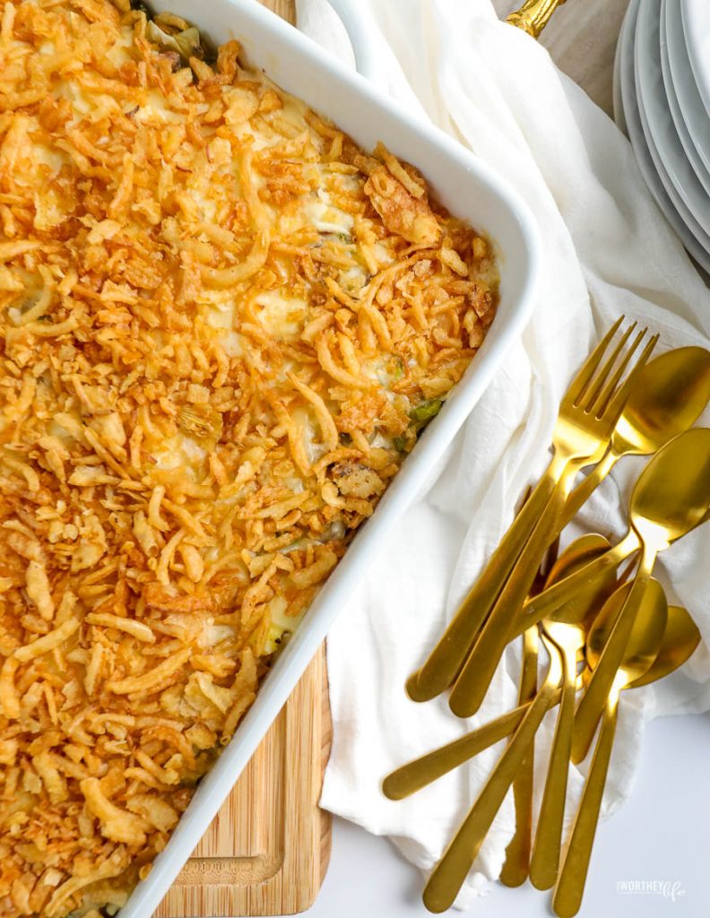 breakfast casserole in a large white dish with gold spoons