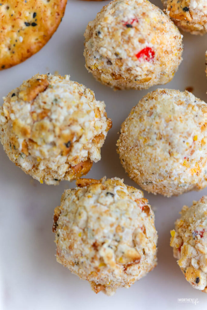 several cheeseballs covered with crumbled multigrain crackers