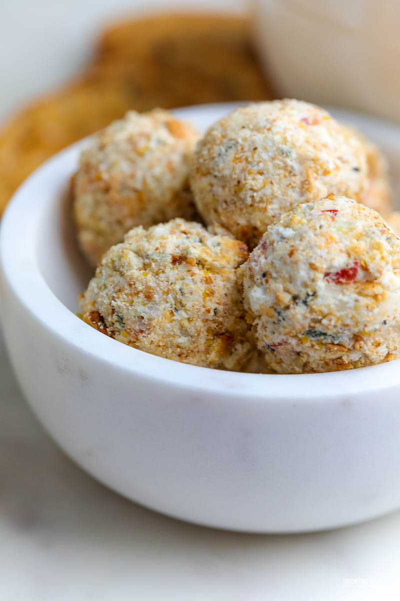 mini savory cheese balls in a white stone bowl