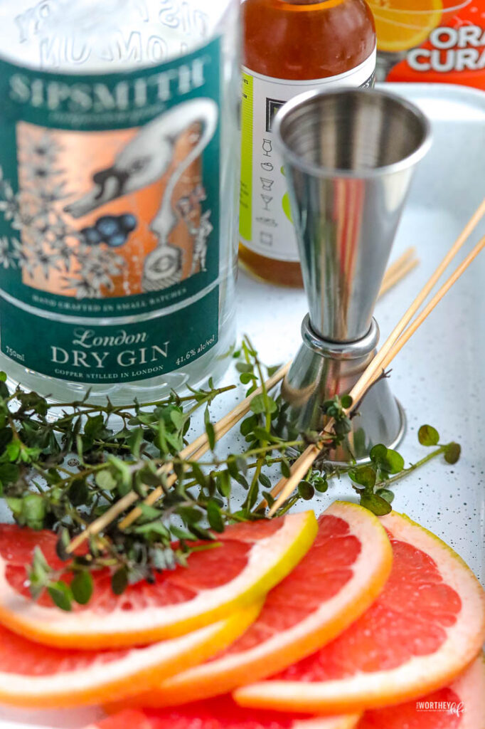fresh grapefruit with a bottle of gin
