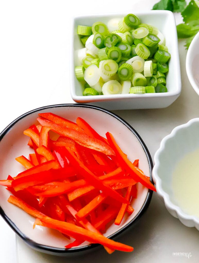small white serving bowls with fresh vegetables