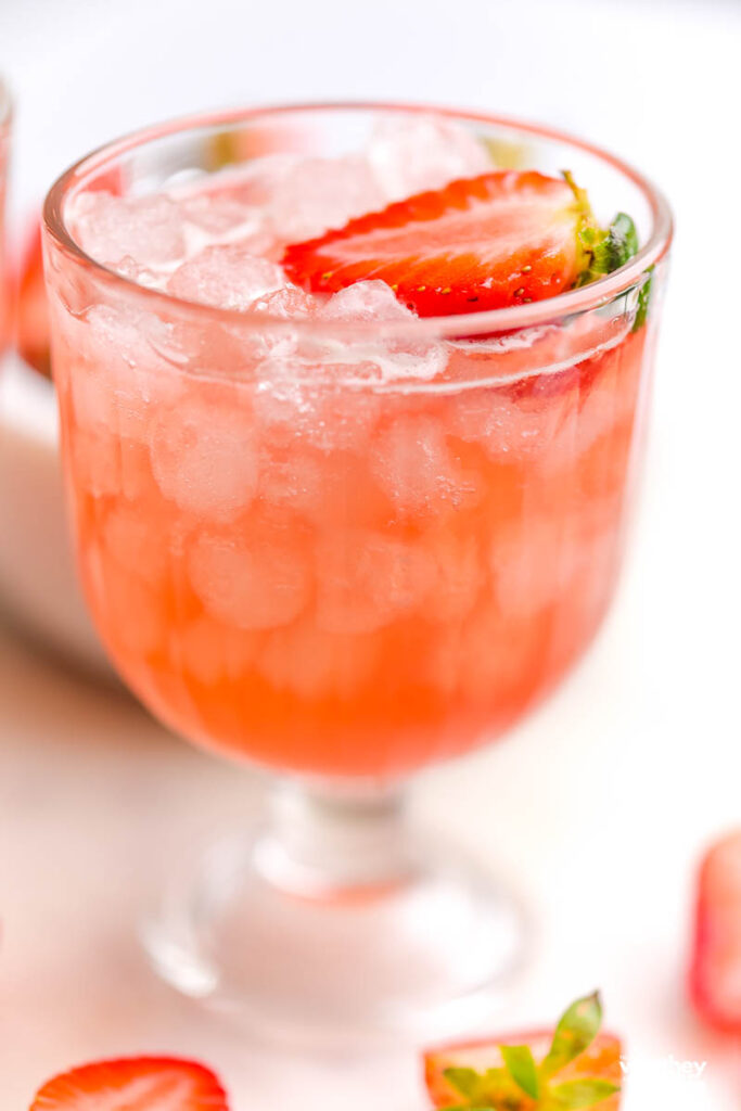 pink mocktail in a tall glass