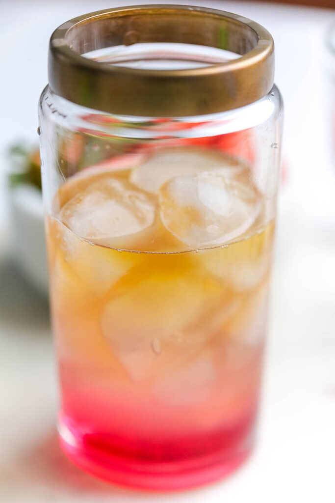 valentine's mocktail in a cocktail shaker with bronze lid