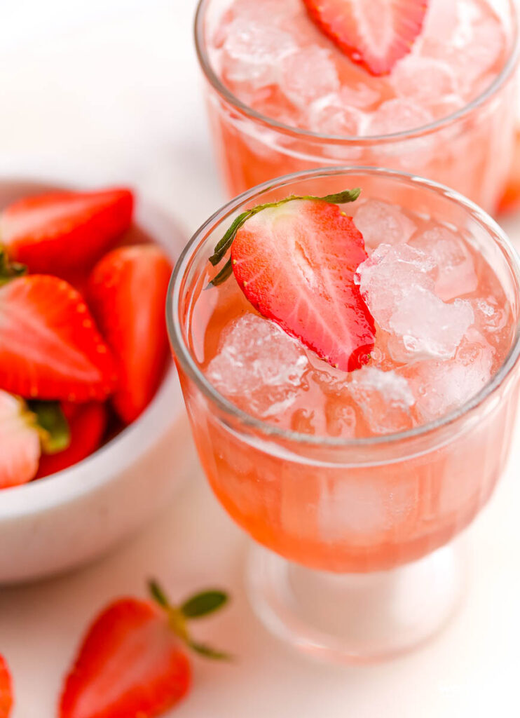 Valentine's Drink Pink Cranberry Mocktail in a clear glass. 