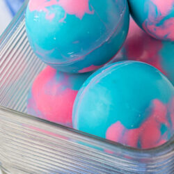 up close photo of hot cocoa bombs in glass container