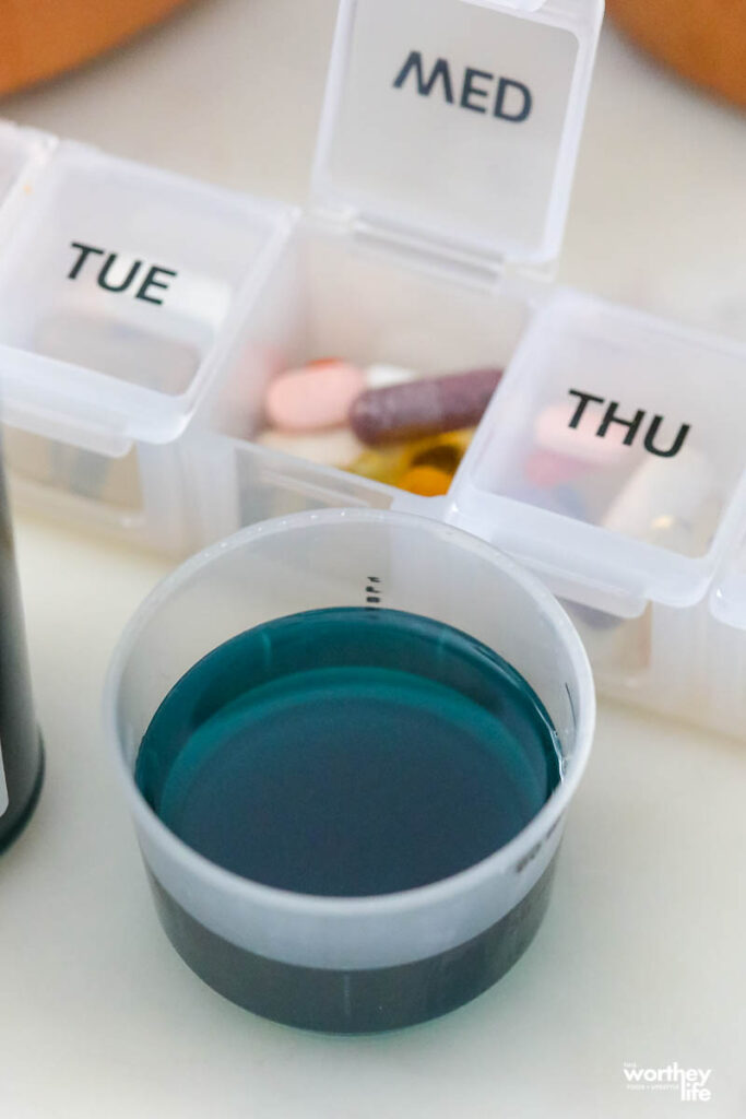 cold medicine in a cup on a white background