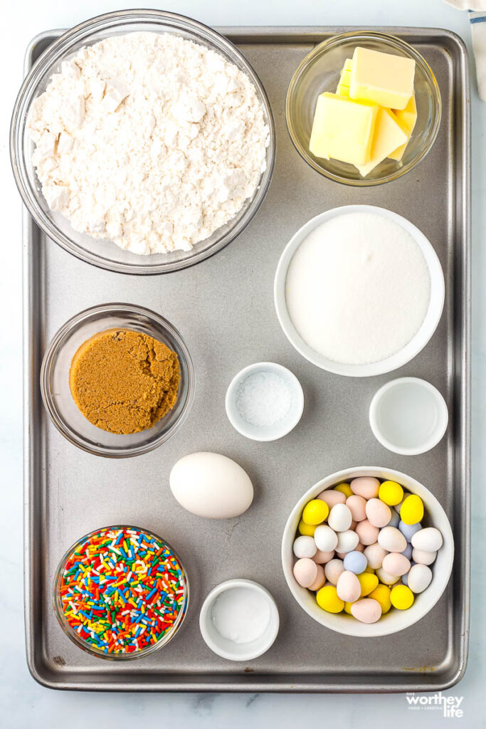 ingredients for cadbury cookies on a cookie sheet