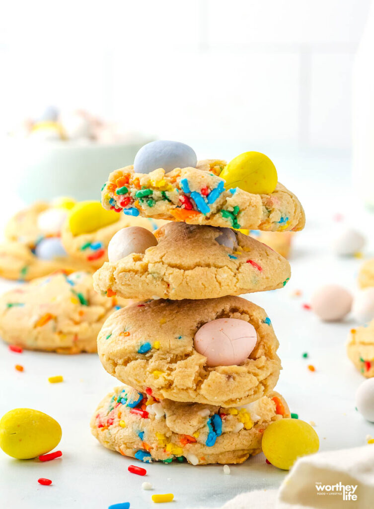 mini egg cookies stacked on top of each other