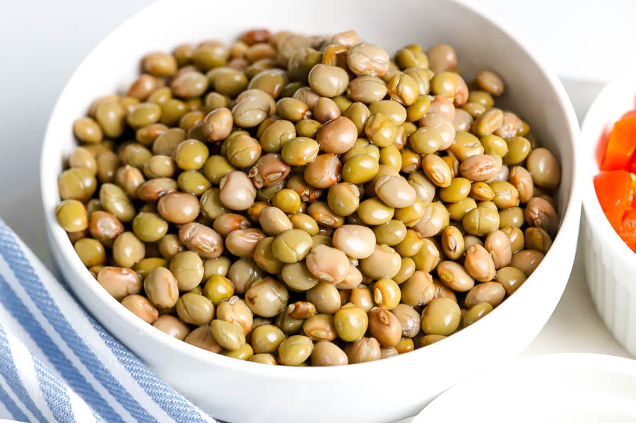 a white bowl filled with pigeon peas