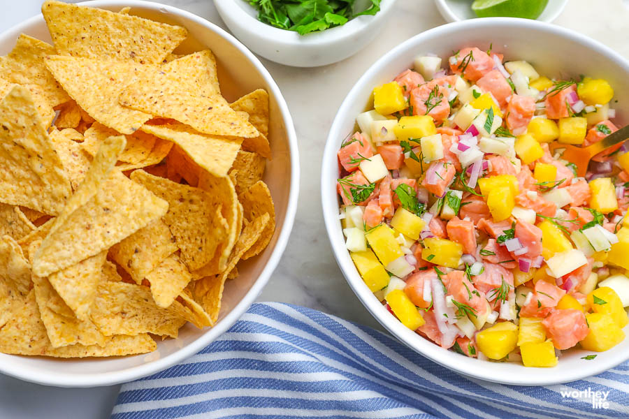 pineapple ceviche in a white bowl with corn chips
