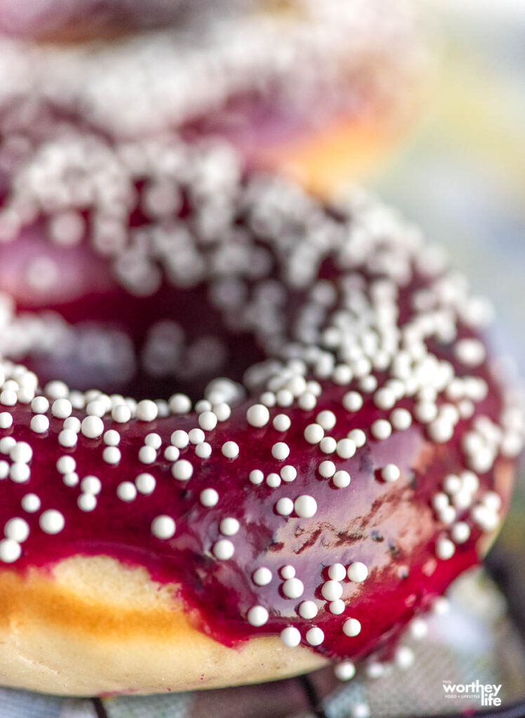 lemon donut with blueberry glaze and powdered sugar