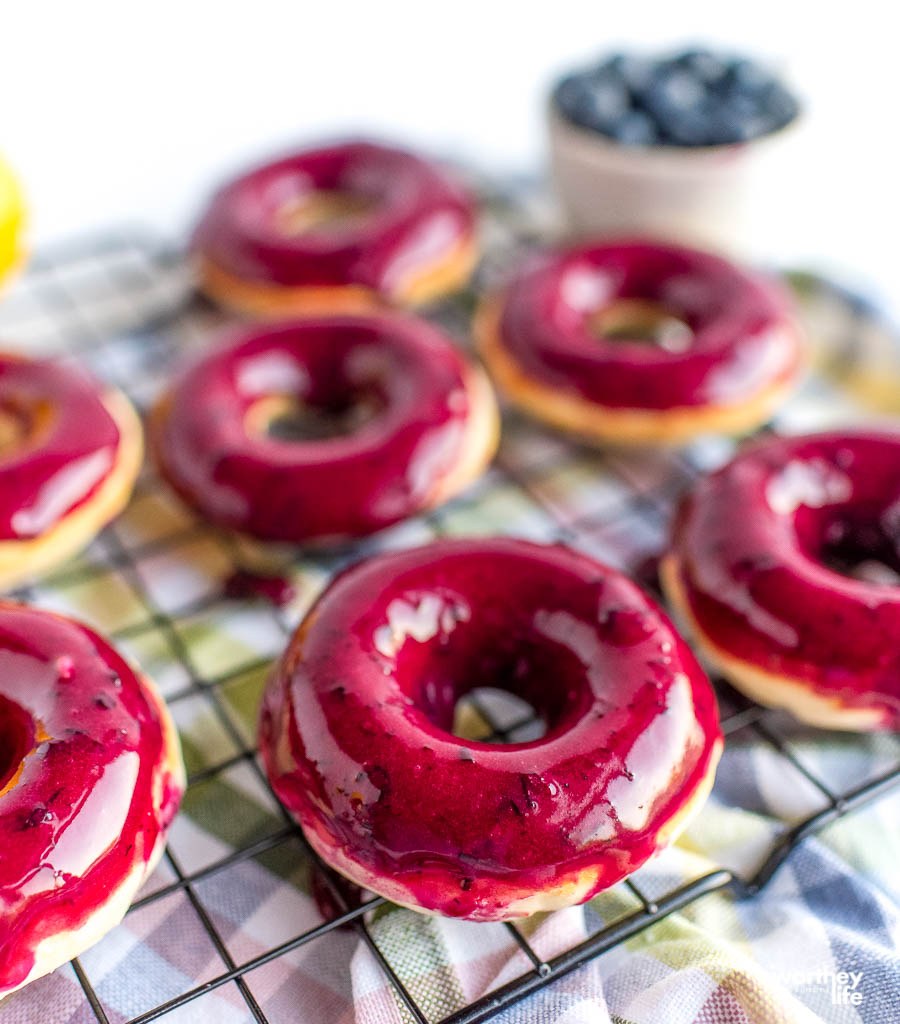 fresh baked donuts on a cooling rack