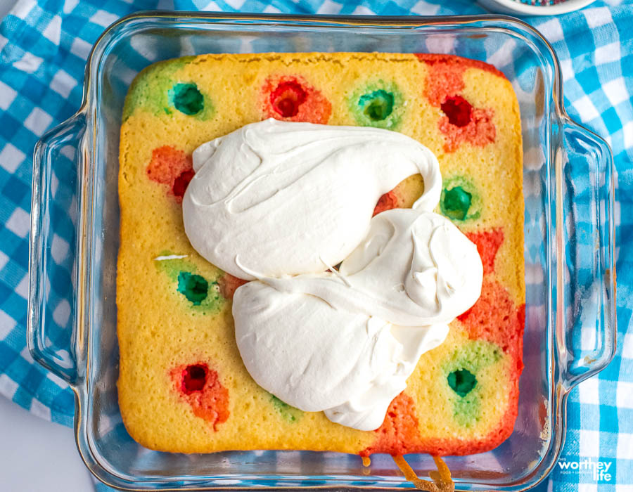 icing a cake in a glass pan