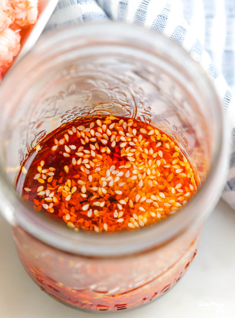 a glass jar filled with an Asian inspired vinaigrette