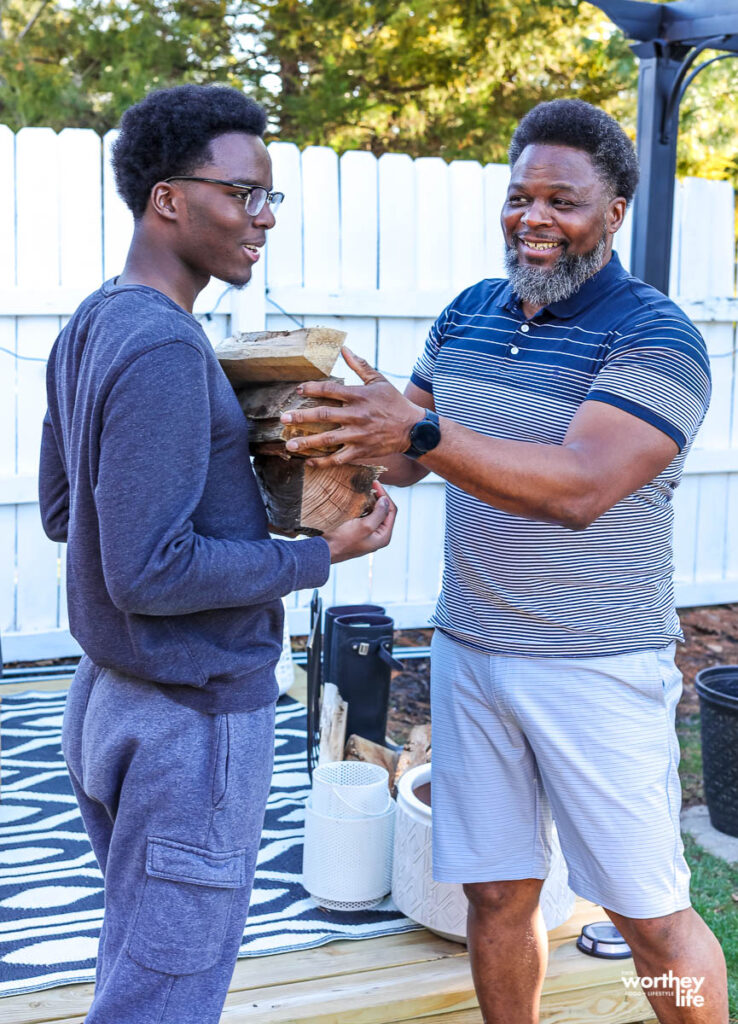 two people collecting fire wood