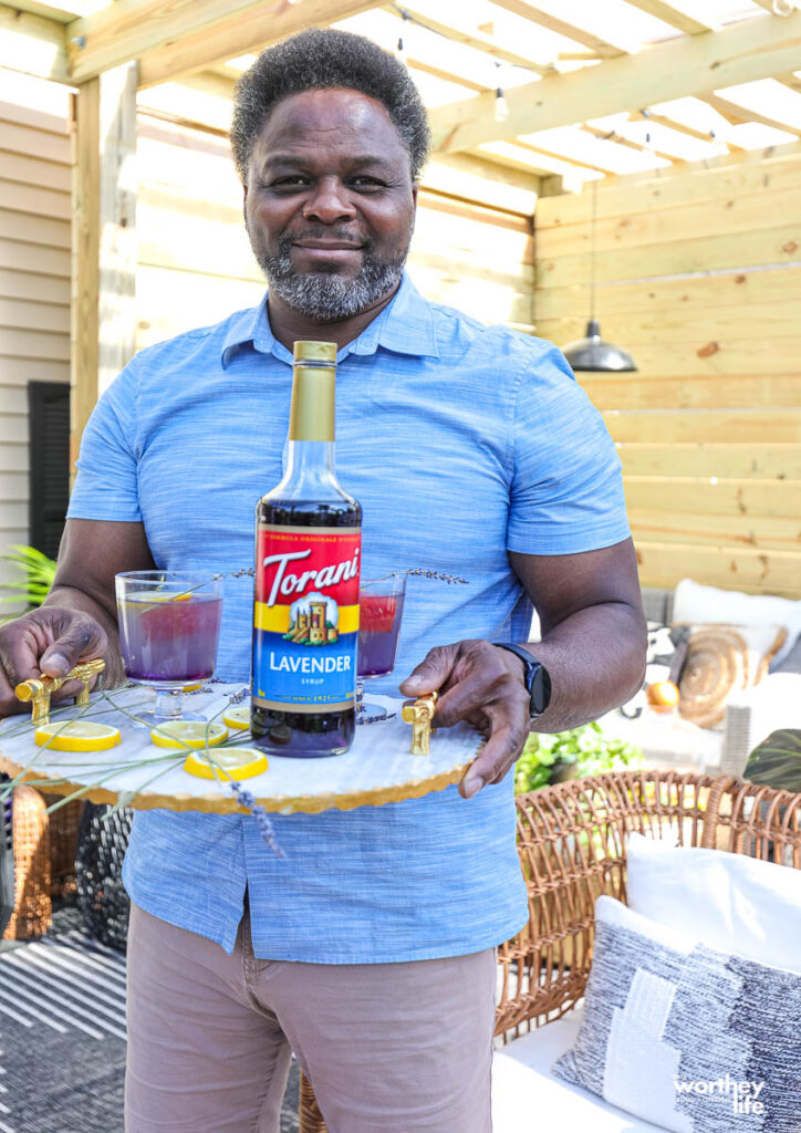 a man holding a serving tray