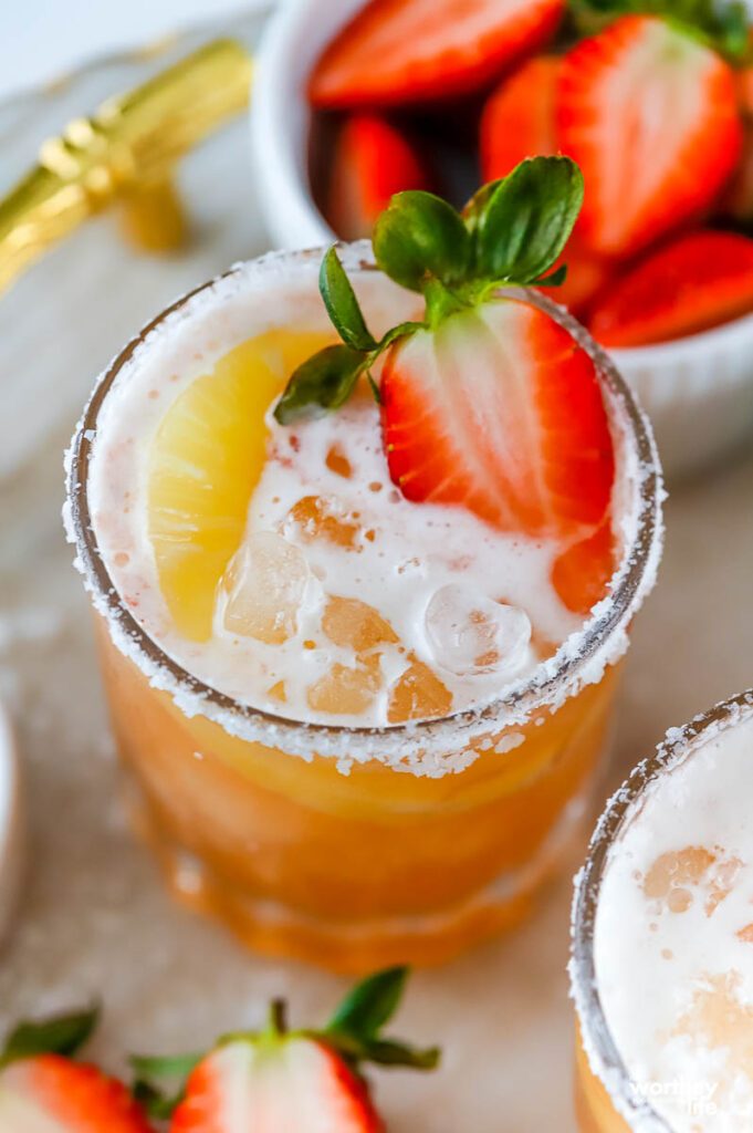 shrub cocktail with pineapple juice and strawberries