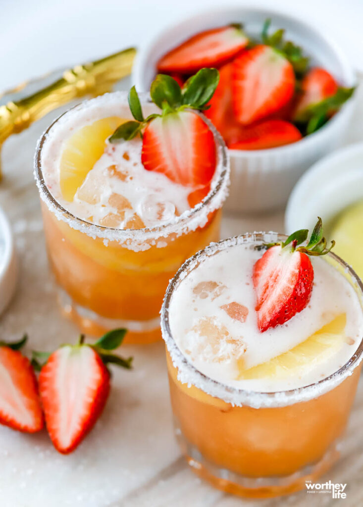 tequila cocktail with strawberry in a cocktail glass