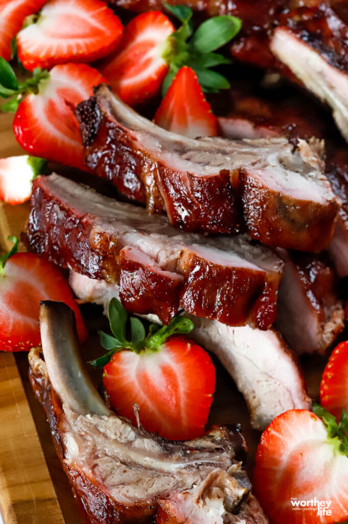 slices of baby back rib with strawberries
