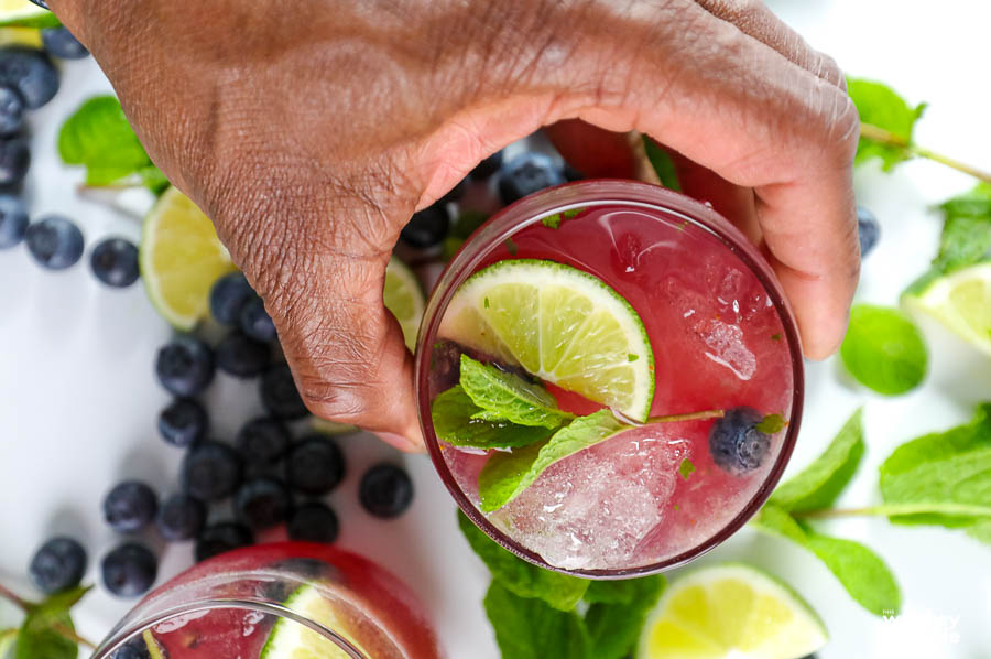 black hand grabbing a drink