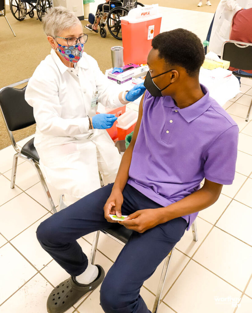 black child getting the covid vaccine