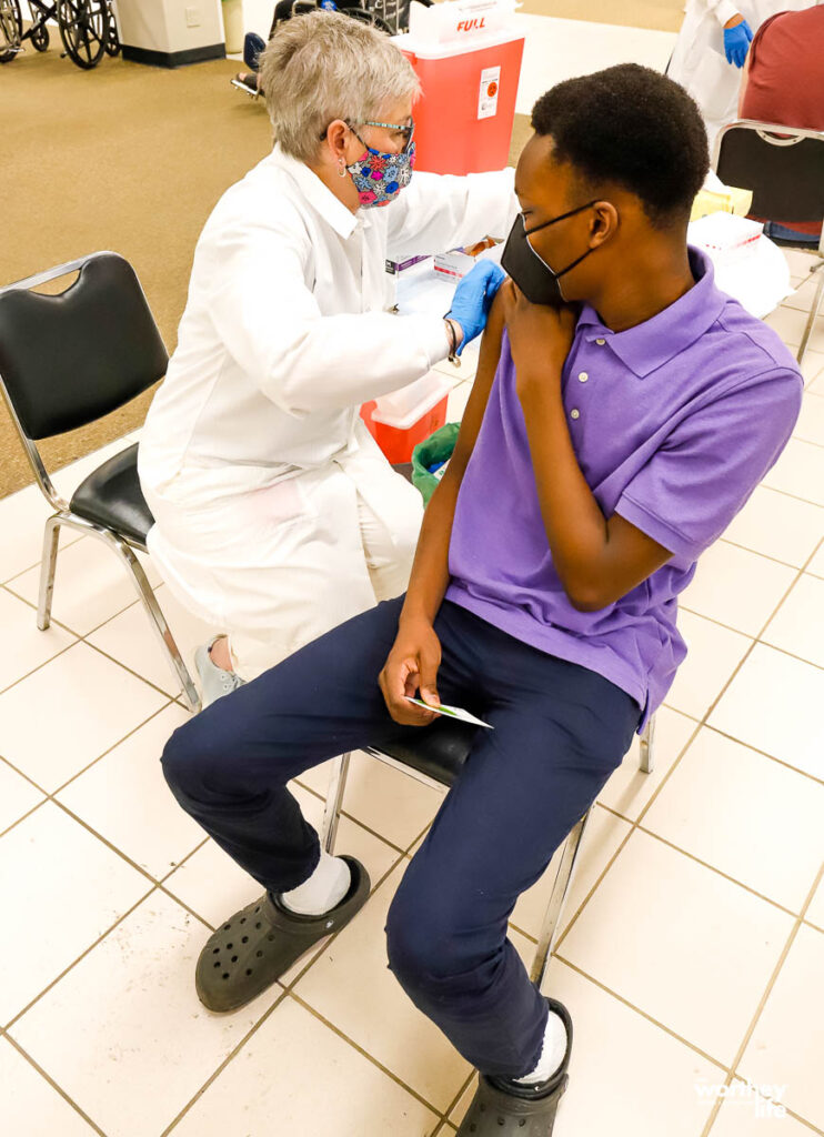 black child getting the covid vaccine