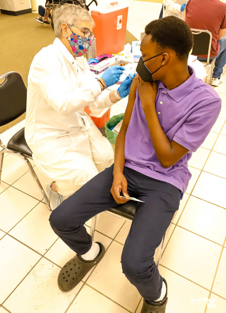 black child getting the covid vaccine