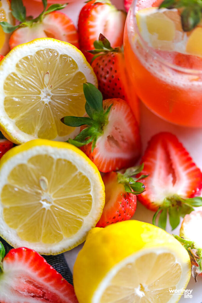 fresh strawberries and sliced lemons