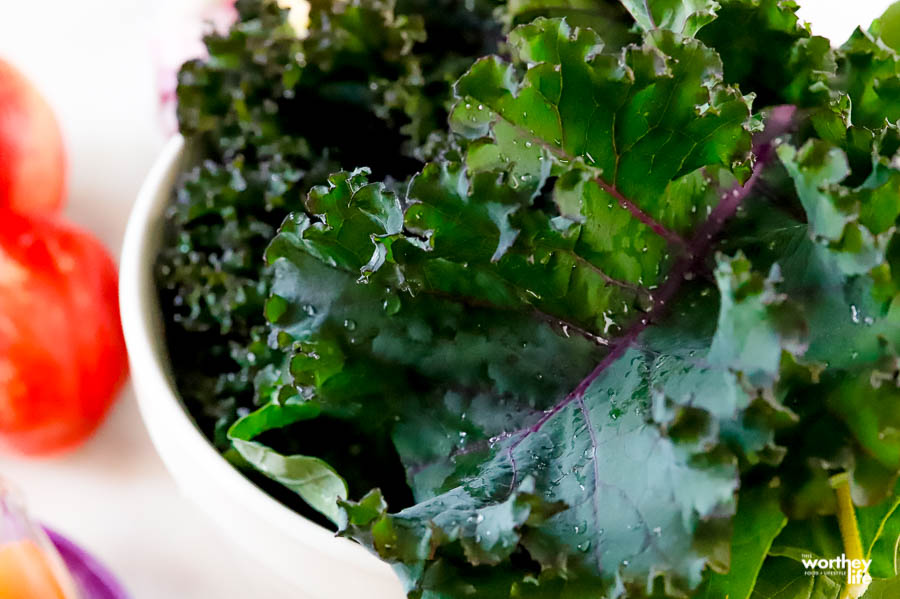 a white bowl filled with fresh garden kale