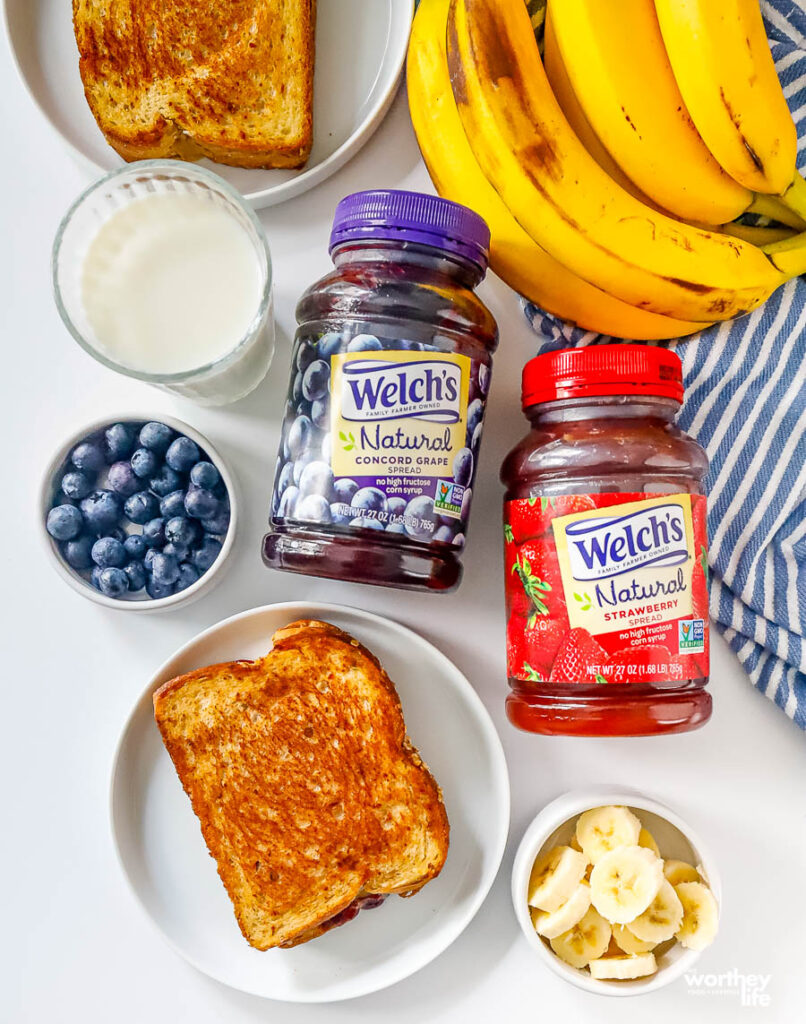 preparing a peanut butter and jelly plus fruit grilled sandwich