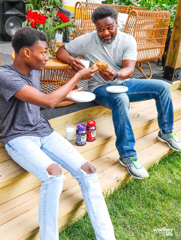 dad and son enjoying PB & J sandwiches