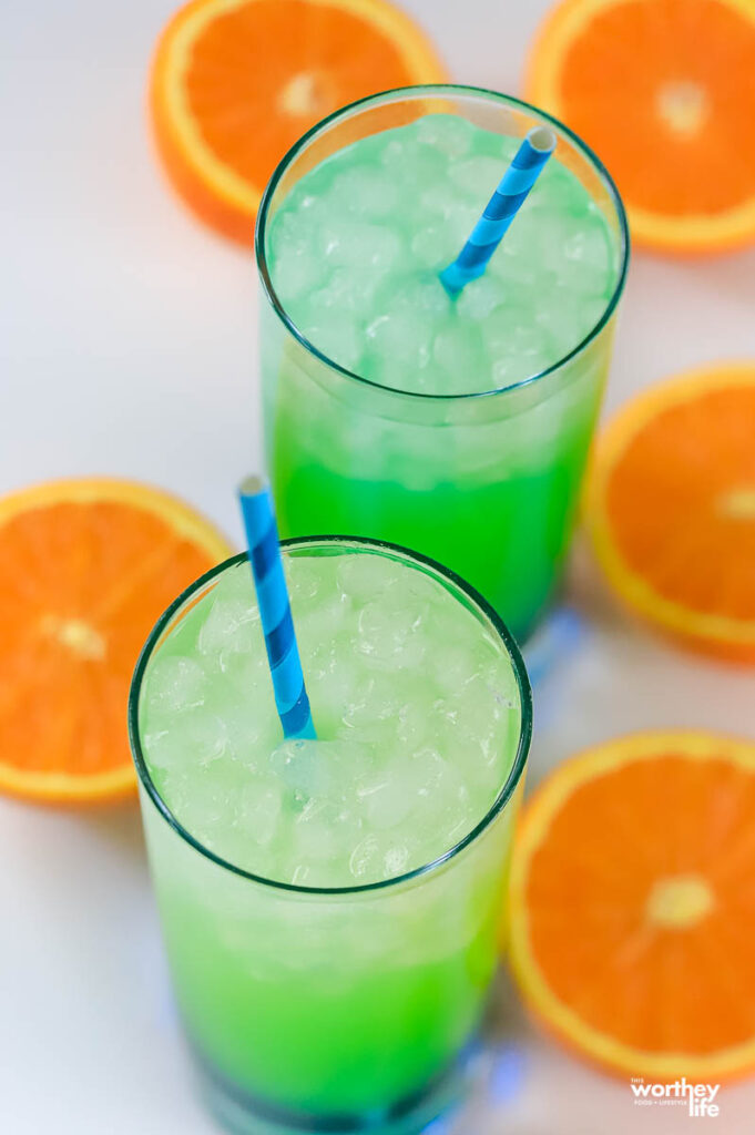 two green and bluish kid drinks