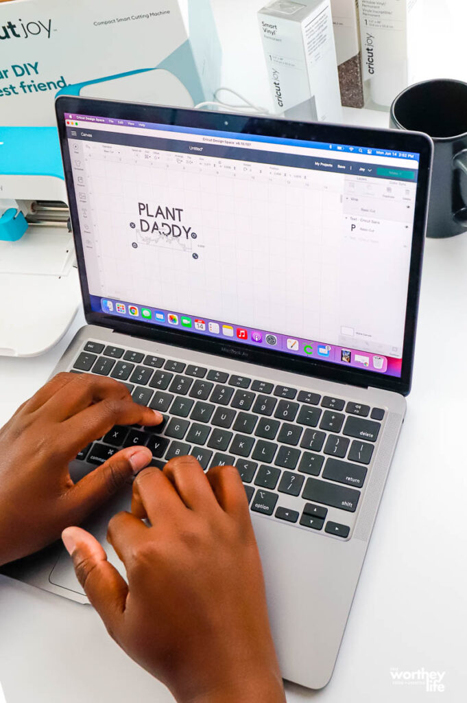 girl using laptop on cricut design space