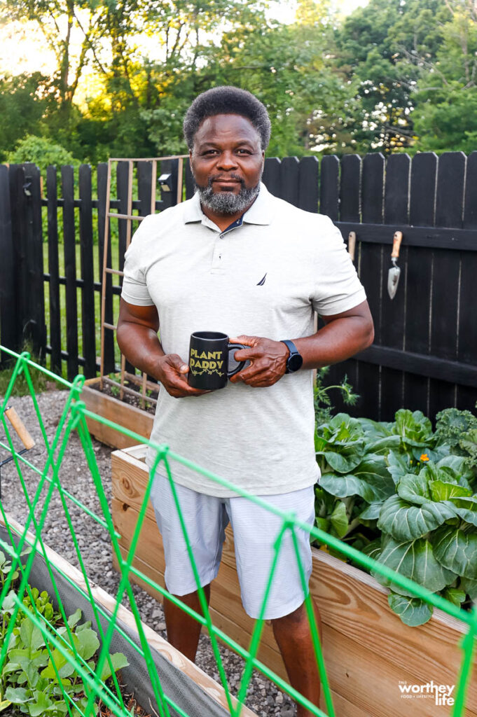 dad in garden with his plant daddy mug