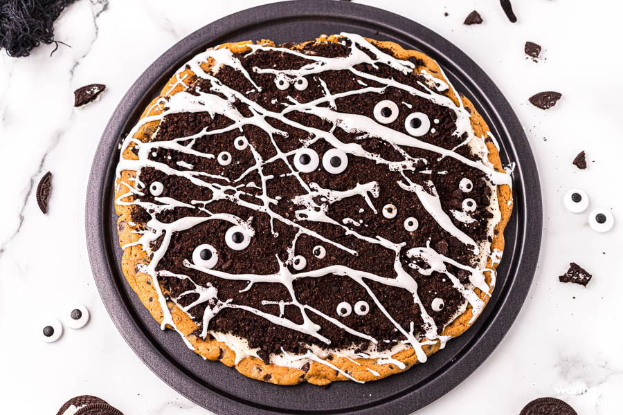 whole cookie dough pizza on white background