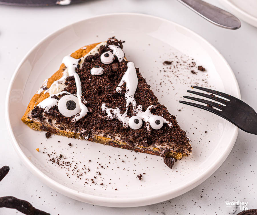 slice of cookie pizza on white plate