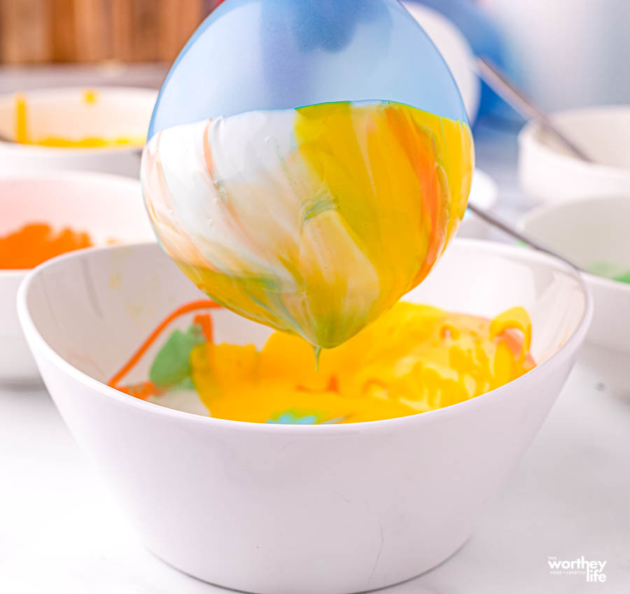 balloon with candy chocolate on it in a white bowl