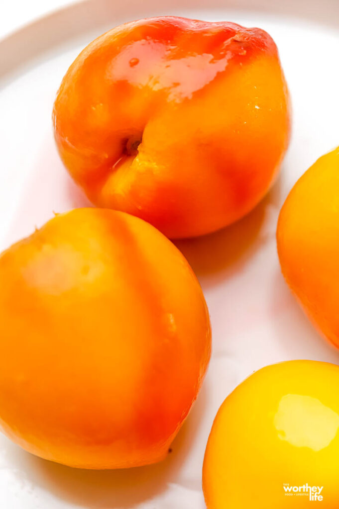 how to cook fresh sweet peaches on white plate