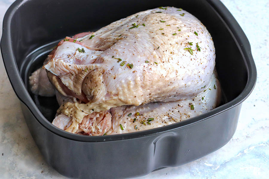 whole turkey breast in the air fryer about to be cooked