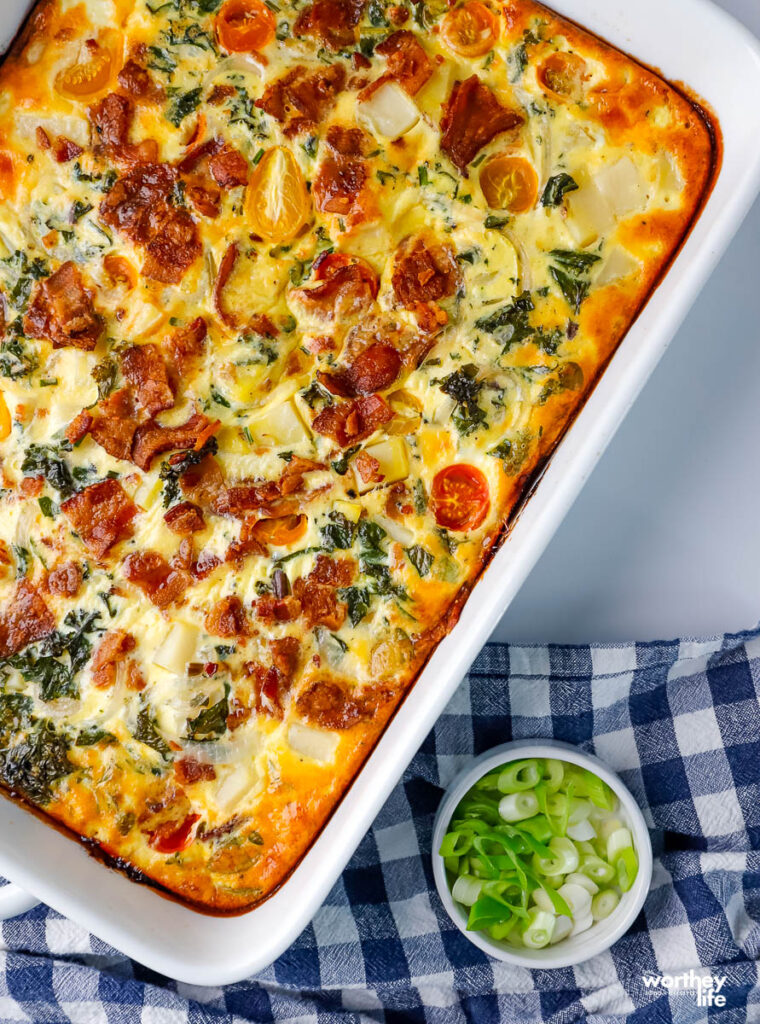 Breakfast Quiche With Potatoes prepared in a large white casserole dish