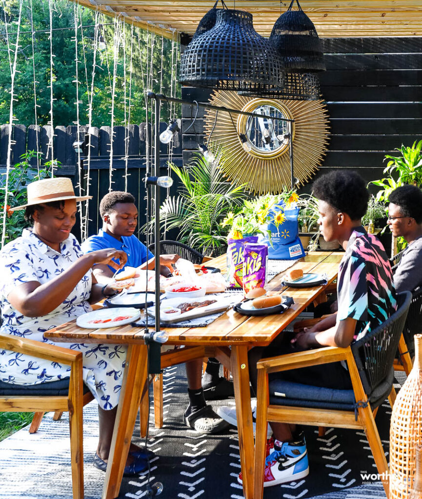 family enjoying eating dinner outdoors