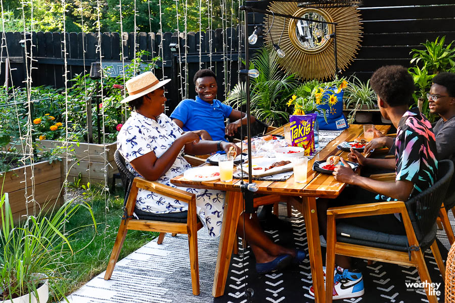 black family enjoying dinner outdoors